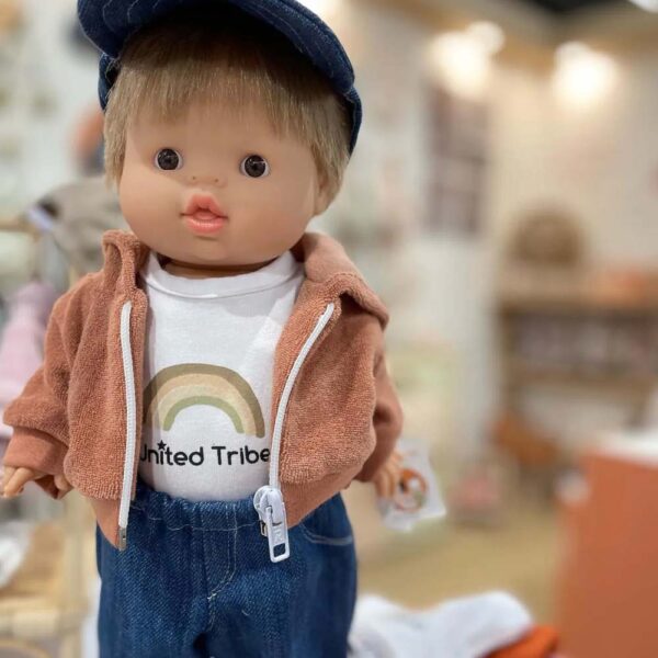 Dressed Minikane doll standing