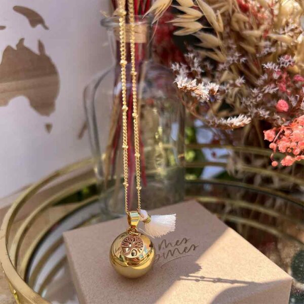 Bola de grossesse or avec pompon blanc