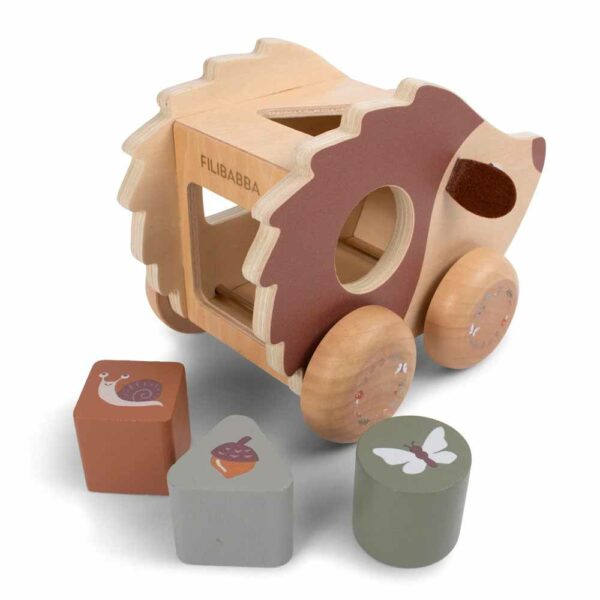Pulling hedgehog with shape sorter